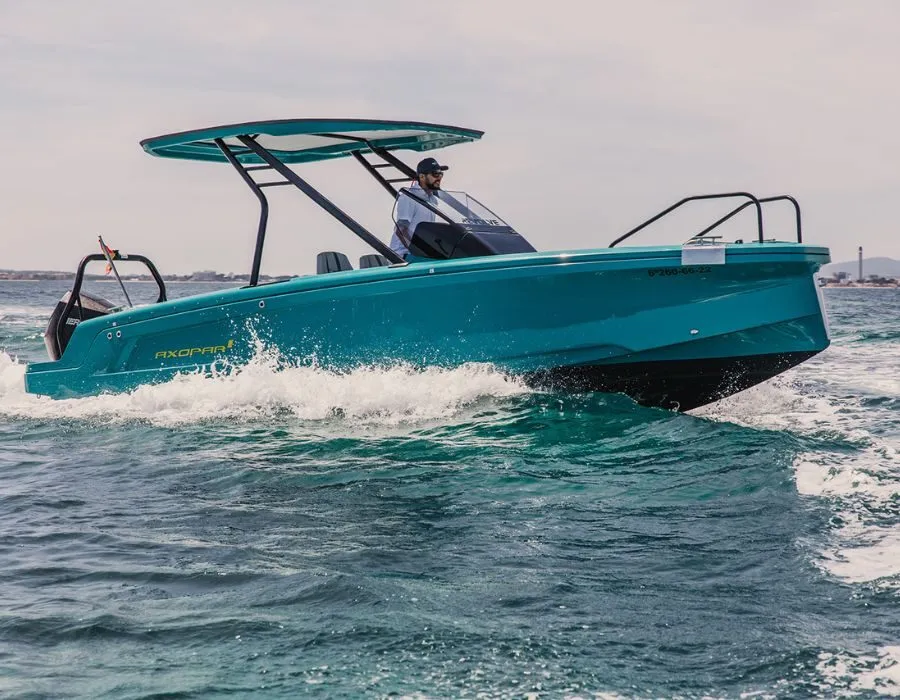 Axopar 22 Spyder cruising close by, with the skipper under the T-top