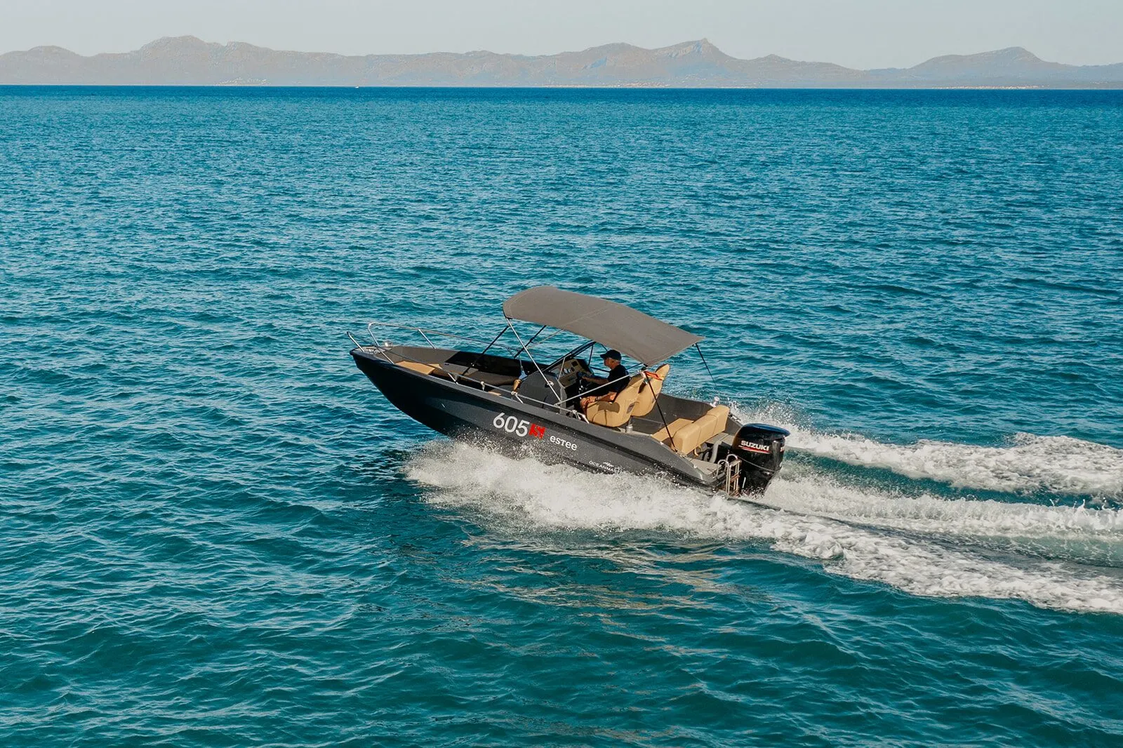 OceanMaster 605 underway in the Bay of Alcudia with mountains on the horizon