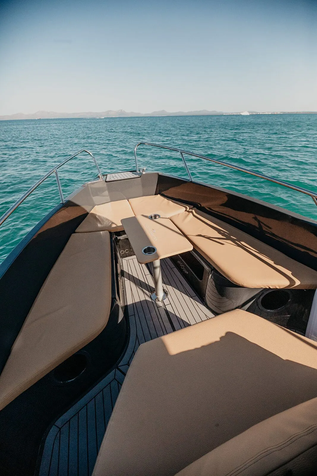 Bow of the OceanMaster 605 with beige sun pad cushions