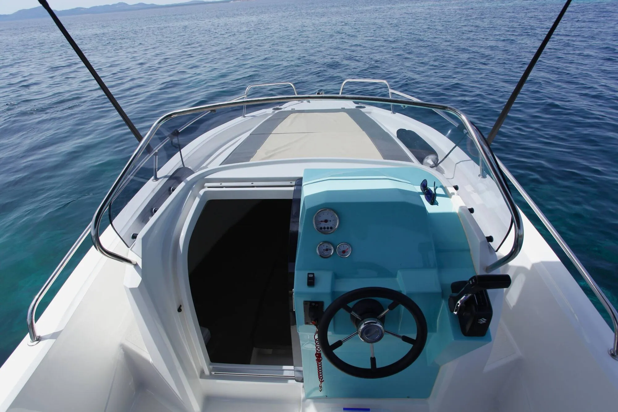 Helm of the Marine Time 563 with steering wheel and cabin door, seen from above