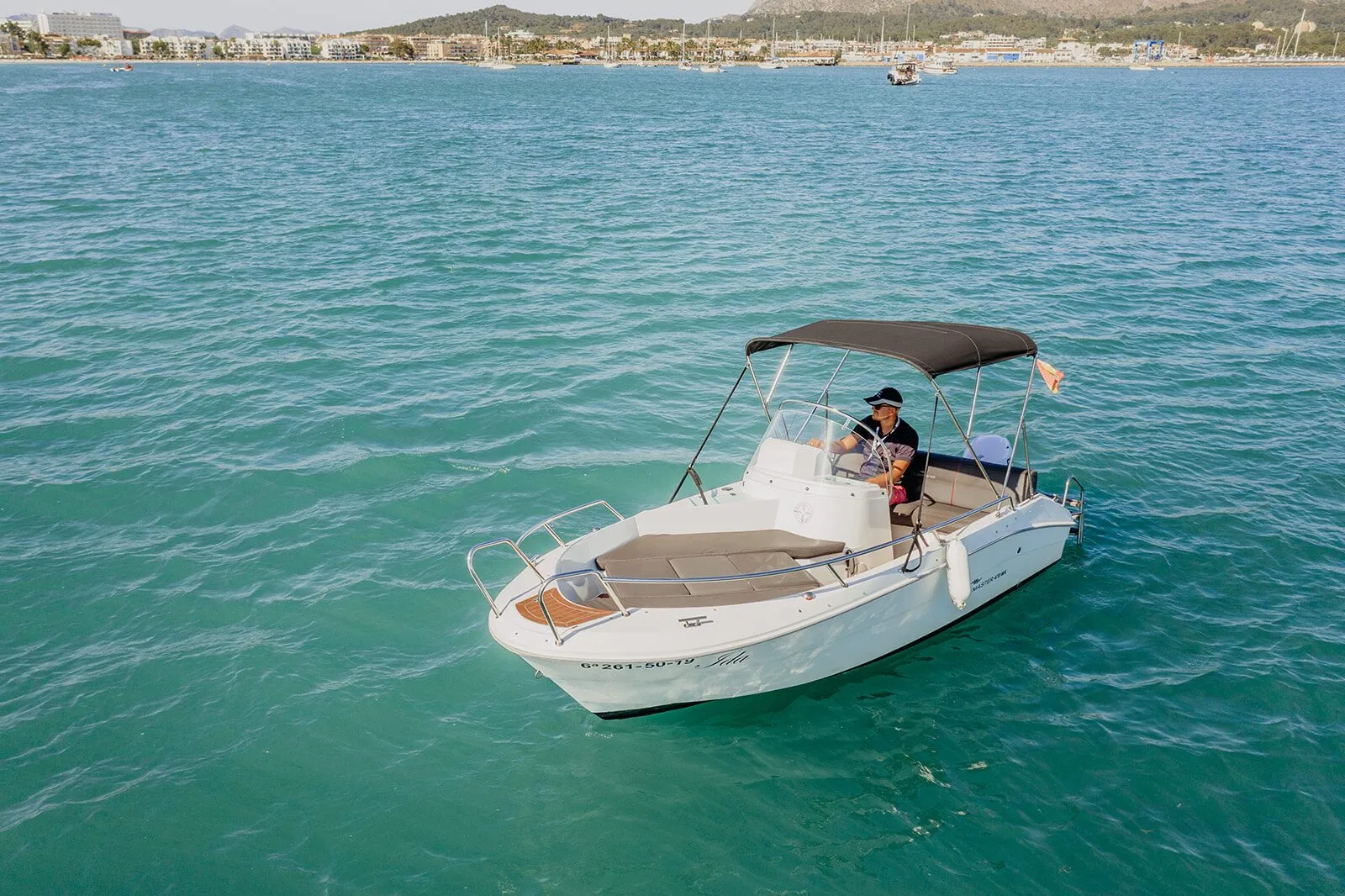 Ocean Master motorboat with a bimini top in the Bay of Alcudia, seen from above