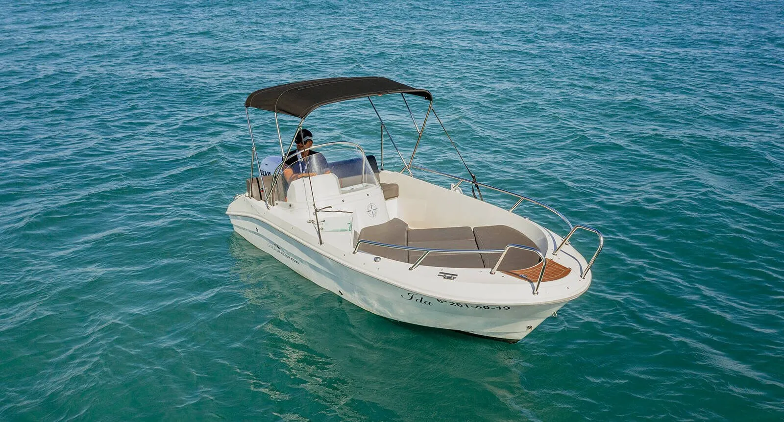 Aerial view of the Ocean Master motorboat on turquoise water