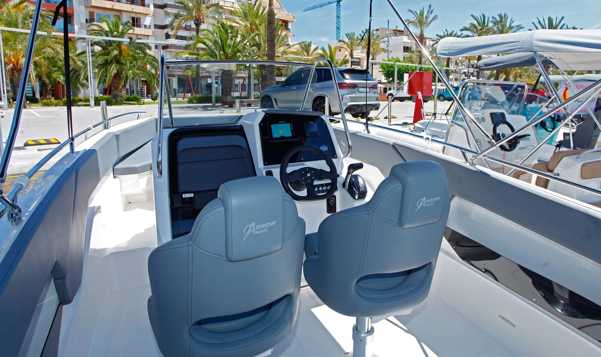 Two grey helm seats and the console of the Abaris 23